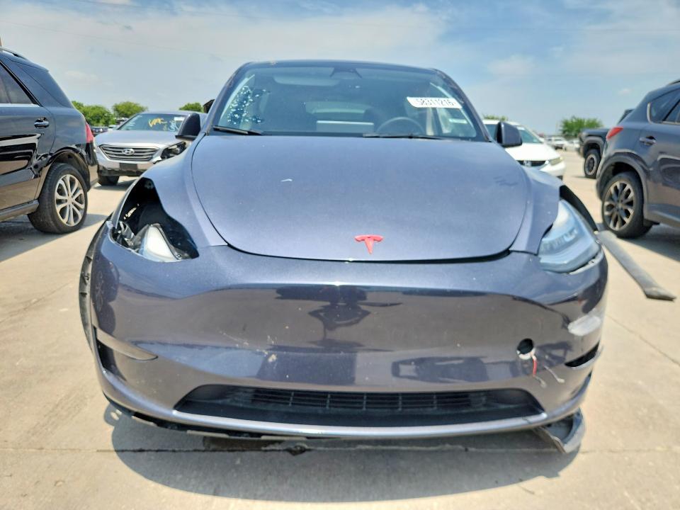2023 Tesla Model y VIN 7SAYGDEE3PA075300 COPART salvage auction — SIDE, Tx - Salvage Vehicle Title, sold $8,100 on 2026-07-27 (photo 5)