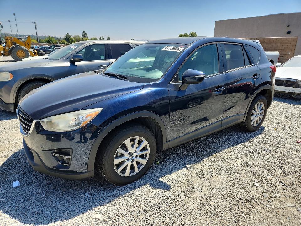 2016 Mazda VIN JM3KE2CY0G0834990 COPART salvage auction — SIDE, Ca - Salvage Certificate, sold $2,950 on 2026-07-15 (photo 1)