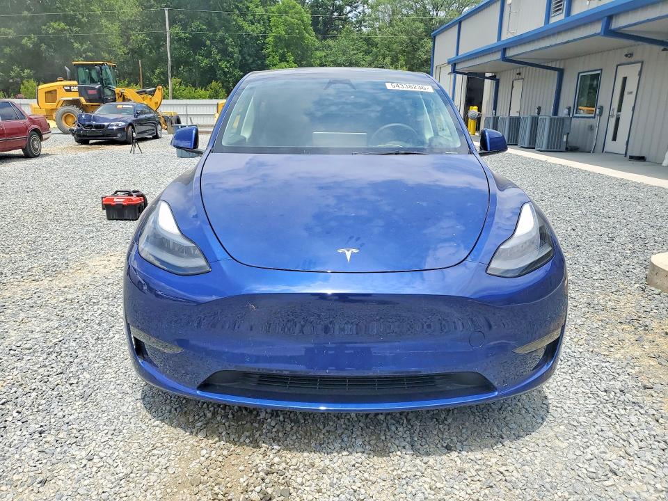 2024 Tesla Model y VIN 7SAYGDEF2RA265200 COPART salvage auction — SIDE, Nc - Salvage Certificate Of Title, sold $13,300 on 2026-07-23 (photo 5)