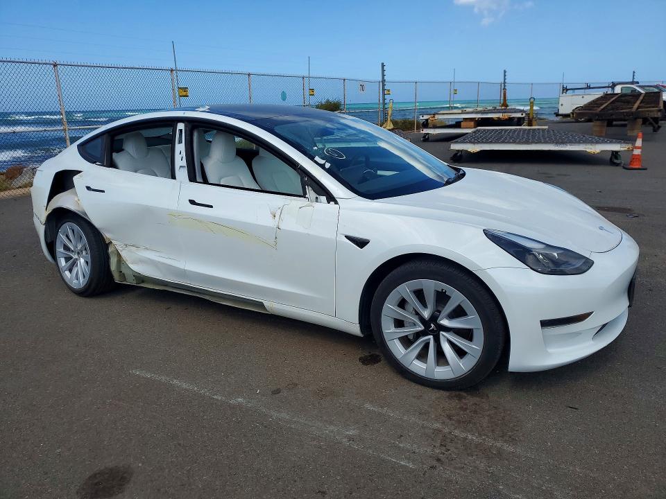 2023 Tesla Model 3 VIN 5YJ3E1EA6PF519586 COPART salvage auction — REAR END, HI - CERTIFICATE OF SALVAGE, sold $3,000 on 2026-09-11 (photo 4)