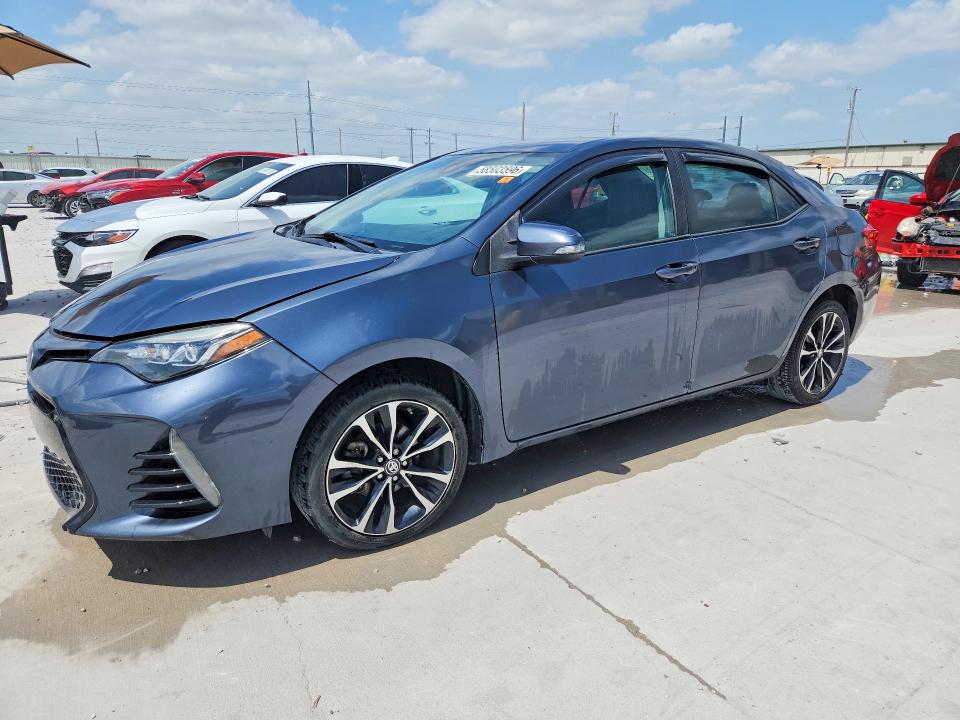 2018 Toyota Corolla VIN 5YFBURHE5JP816565 COPART salvage auction — WATER/FLOOD, TX - SALVAGE TITLE-FLOOD DAMAGE, sold $1,800 on 2026-07-24 (photo 1)