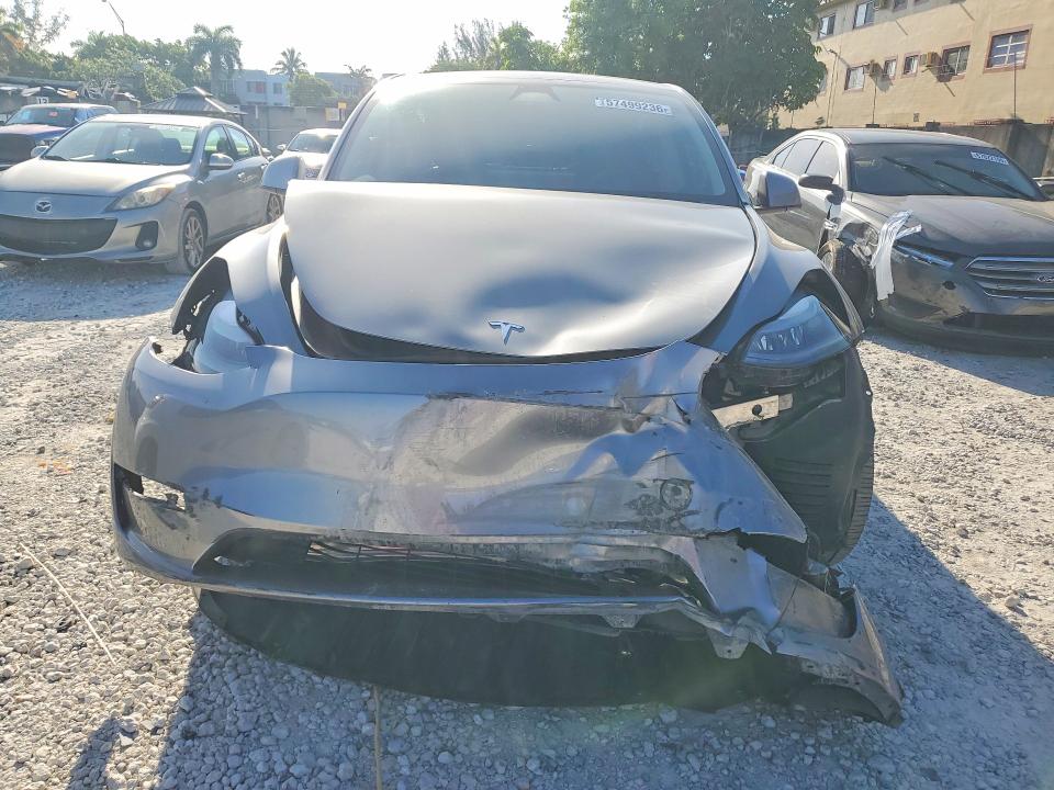 2025 Tesla Model y VIN 7SAYGDED6SF256667 COPART salvage auction — FRONT END, Fl - Cert Of Title Slvg Rebuildable, sold $15 on 2026-07-24 (photo 5)