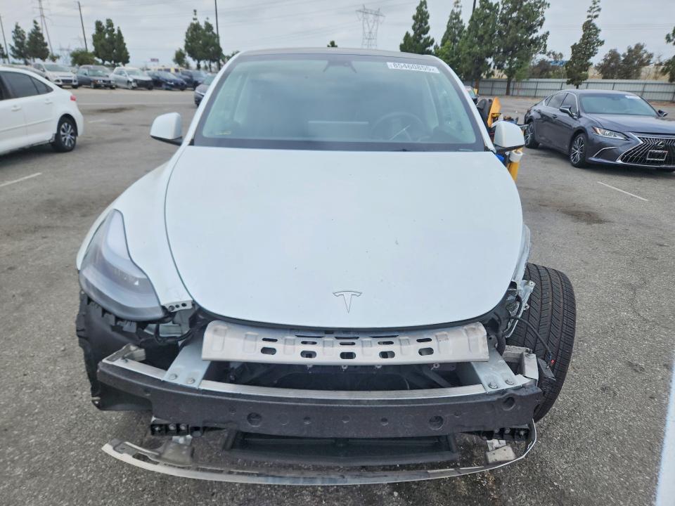 2023 Tesla Model y VIN 7SAYGDEE5PA096147 COPART salvage auction — FRONT END, Salvage Title, sold $11,600 on 2026-07-30 (photo 5)