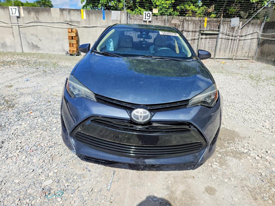 2017 Toyota Corolla VIN 5YFBURHE9HP703339 COPART salvage auction — SIDE, Fl - Cert Of Title Slvg Rebuildable, sold $3,750 on 2026-07-10 (photo 5)