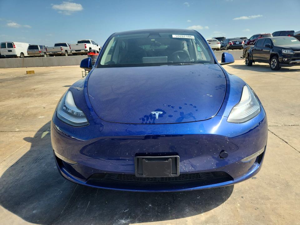 2023 Tesla Model y VIN 7SAYGDEEXPA064469 COPART salvage auction — SIDE, TX - SALVAGE VEHICLE TITLE (P), sold $5,900 on 2026-07-16 (photo 5)