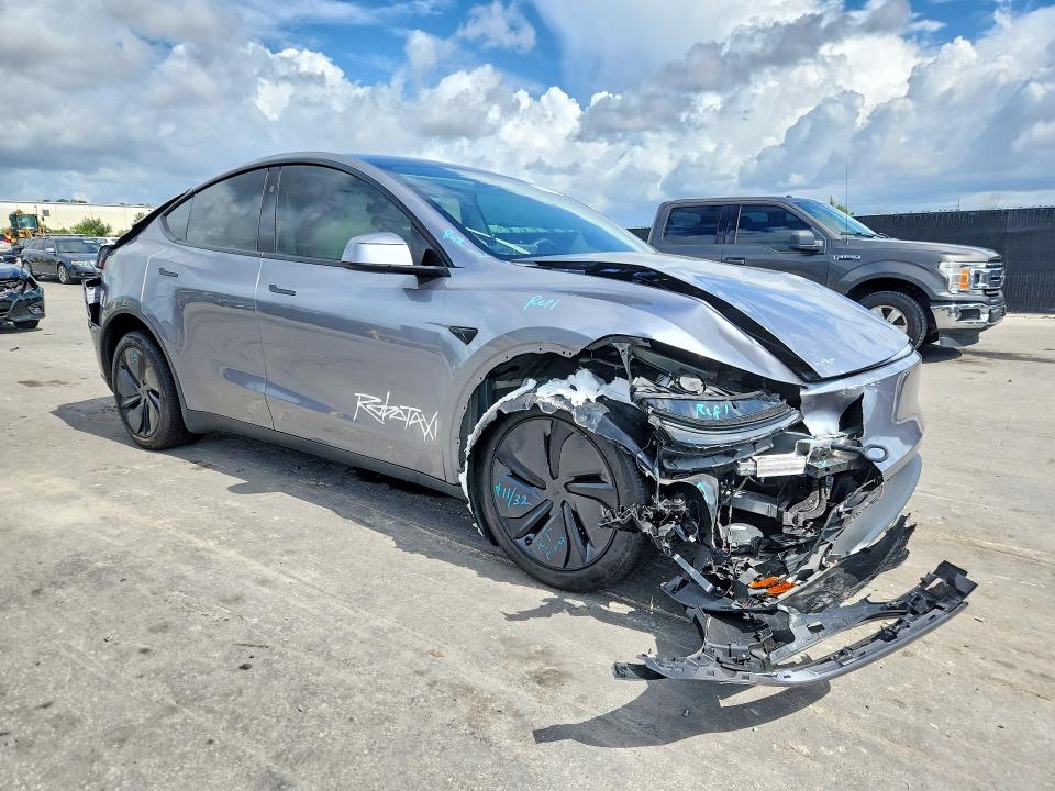 2026 Tesla Model y VIN 7SAYGDEE1TA401122 COPART salvage auction — REAR END, Fl - Cert Of Title Slvg Rebuildable, sold $13,100 on 2026-07-30 (photo 4)