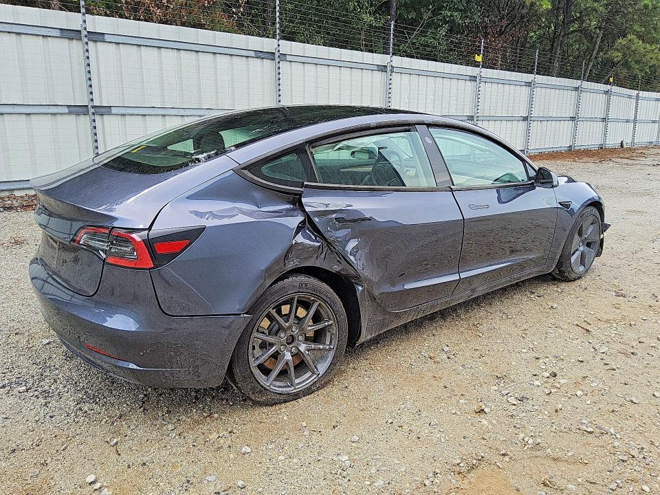 2023 Tesla Model 3 VIN 5YJ3E1EA5PF491330 COPART salvage auction — SIDE, GA - CERTIFICATE OF TITLE (P), sold $7,700 on 2026-07-16 (photo 3)