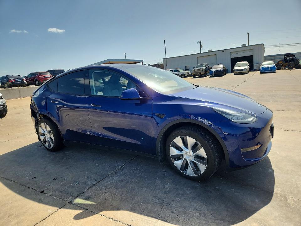 2023 Tesla Model y VIN 7SAYGDEEXPA064469 COPART salvage auction — SIDE, TX - SALVAGE VEHICLE TITLE (P), sold $5,900 on 2026-07-16 (photo 4)