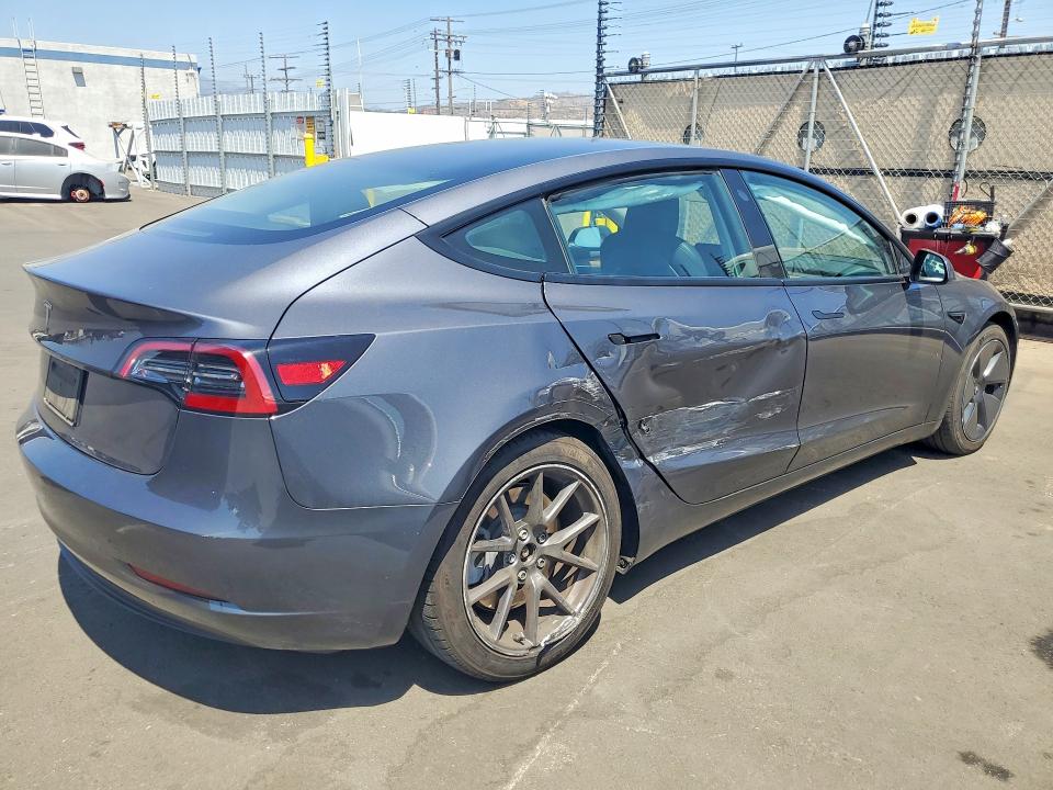 2023 Tesla Model 3 VIN 5YJ3E1EA3PF656579 COPART salvage auction — SIDE, Salvage Title, sold $8,300 on 2026-07-13 (photo 3)