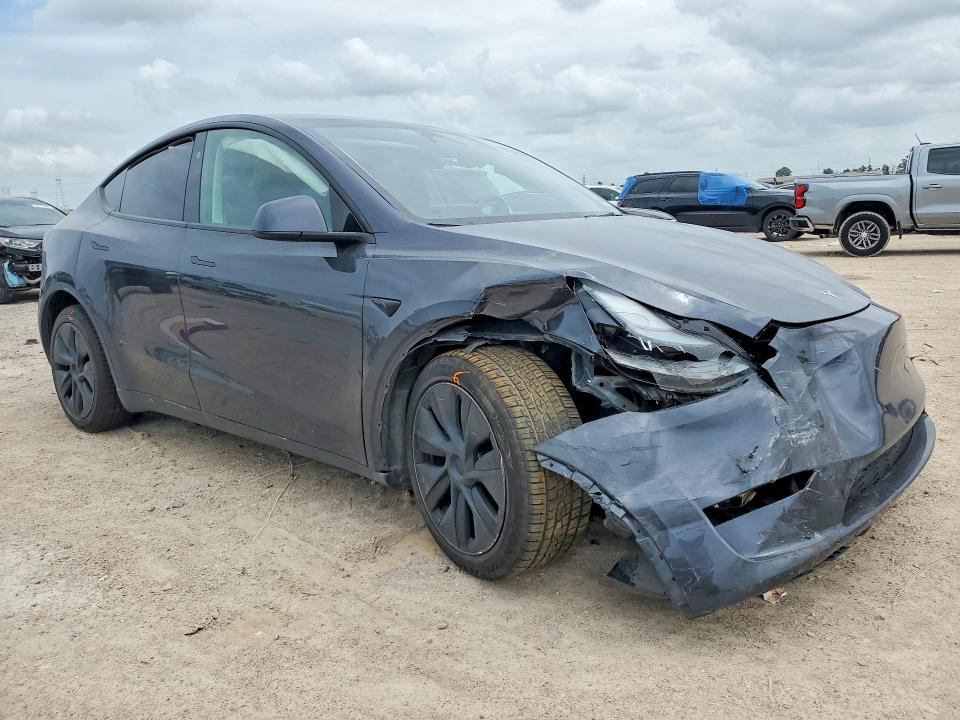 2025 Tesla Model y VIN 7SAYGDEE9SA353397 COPART salvage auction — FRONT END, TX - SALVAGE VEHICLE TITLE (P), sold $14,000 on 2026-07-17 (photo 4)