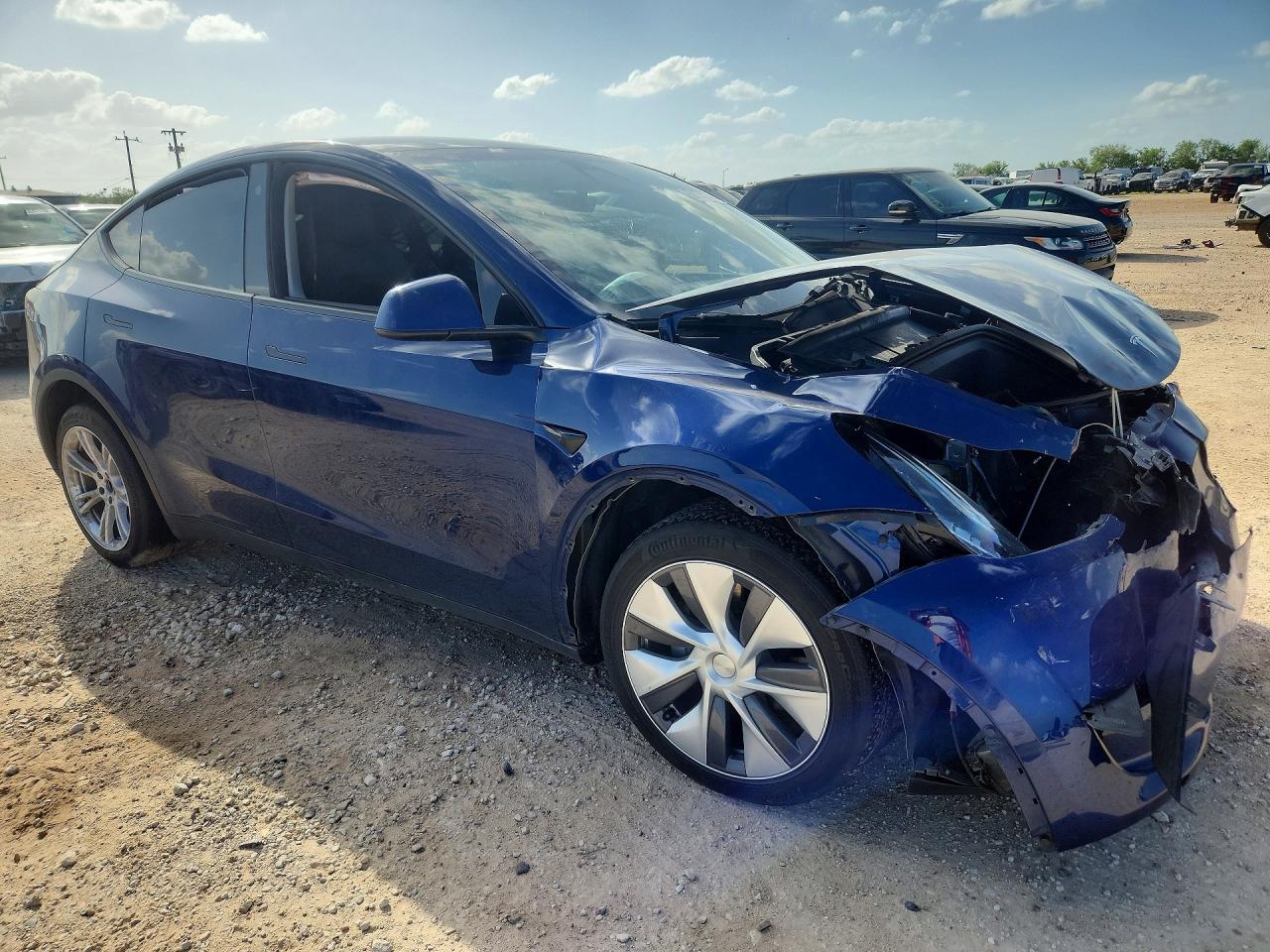 2023 Tesla Model Y VIN 7SAYGDEE6PA107897 COPART salvage auction — Front End, TX - SALVAGE VEHICLE TITLE, sold $9,000 on 2026-07-09 (photo 4)