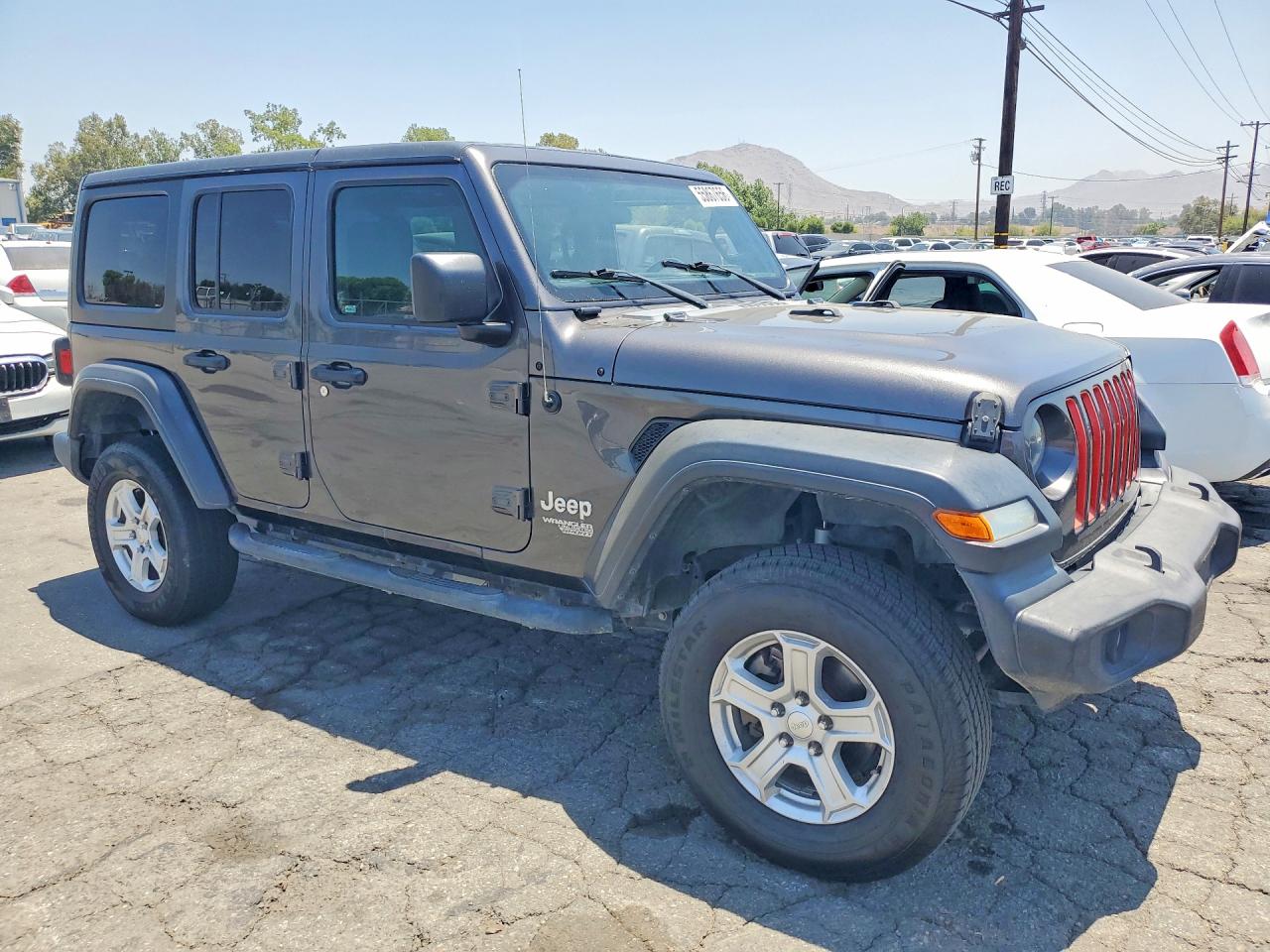 2018 Jeep Wrangler Unlimited VIN 1C4HJXDNXJW145348 COPART salvage auction — Minor Dent/Scratches, FL - DERELICT VEHICLE CERTIFICATE, sold $9,900 on 2026-07-02 (photo 4)