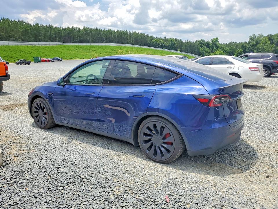 2024 Tesla Model y VIN 7SAYGDEF2RA265200 COPART salvage auction — SIDE, Nc - Salvage Certificate Of Title, sold $13,300 on 2026-07-23 (photo 2)