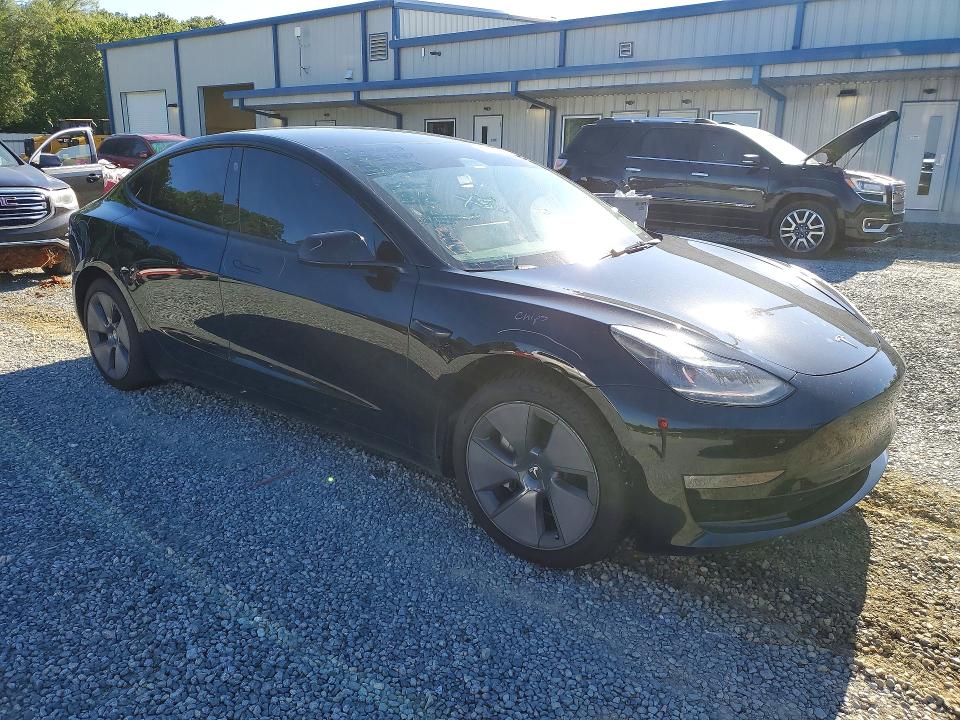2022 Tesla Model 3 VIN 5YJ3E1EB6NF272897 COPART salvage auction — SIDE, Nc - Salvage Certificate Of Title, sold $5,700 on 2026-07-23 (photo 4)