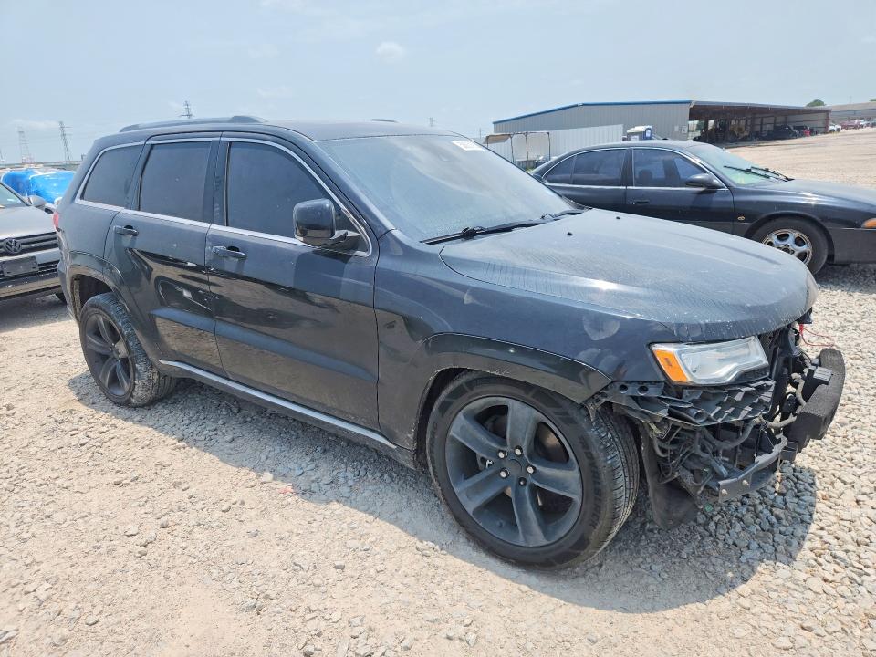 2015 Jeep VIN 1C4RJFJT3FC676501 COPART salvage auction — WATER/FLOOD, Tx - Salvage Title-Flood Damage, sold $875 on 2026-07-02 (photo 4)