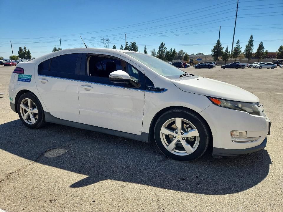 2014 Chevrolet VIN 1G1RE6E4XEU138001 COPART salvage auction — MECHANICAL, Ca - Dis/Dlr/Exp Only Clean Title, sold $1,300 on 2026-07-09 (photo 4)