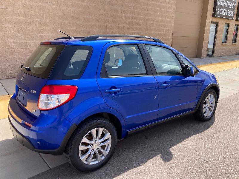 2013 Suzuki Sx4 VIN JS2YB5A31D6101902 COPART salvage auction — DAMAGE HISTORY, Co - Dlr/Dis/Exp-Ct Others-Ca Acq (P), sold $450 on 2026-07-09 (photo 4)