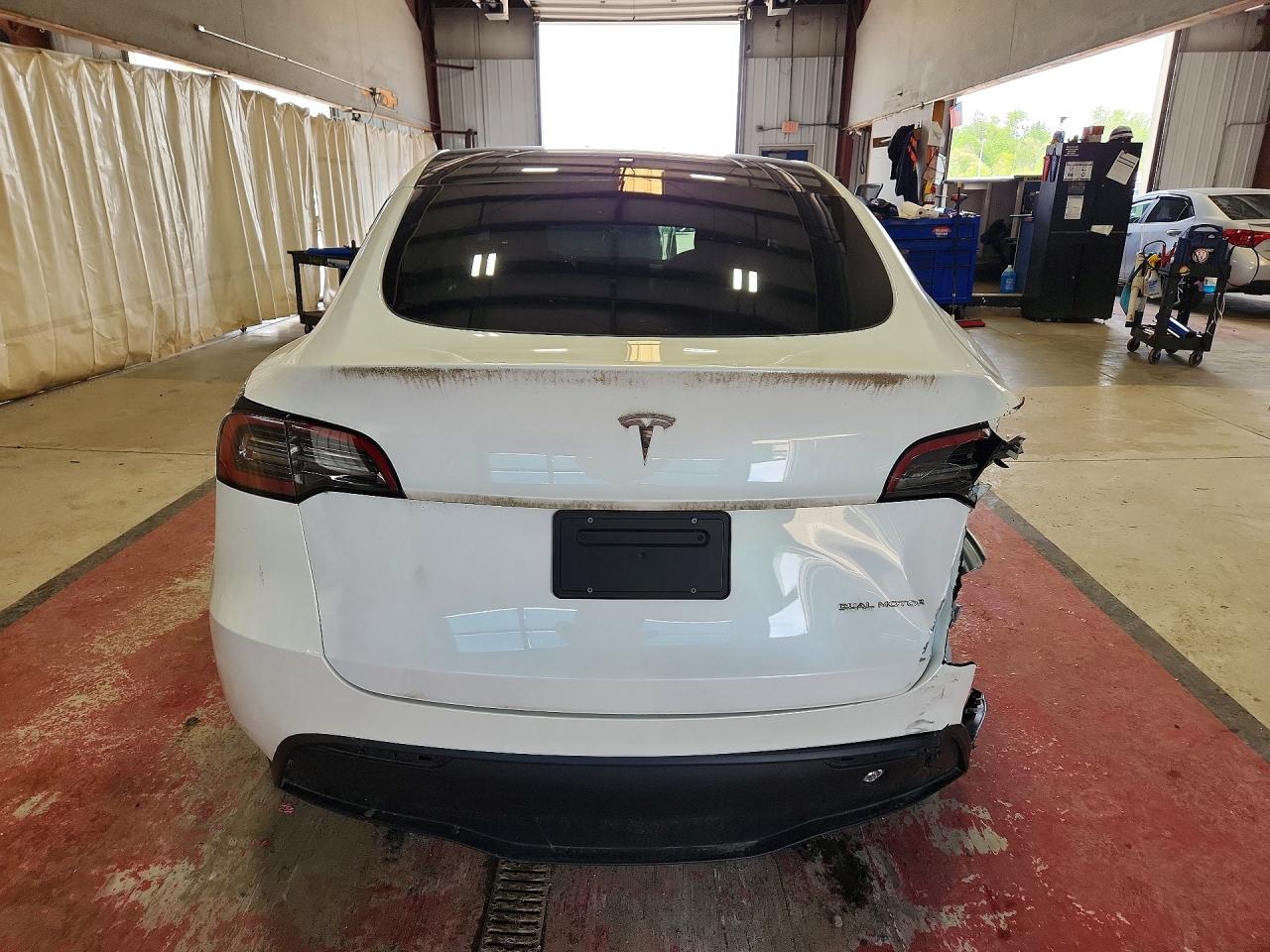 2023 Tesla Model Y VIN 7SAYGDEE7PF606971 COPART salvage auction — Rear End, NY - MV-907A SALVAGE CERTIFICATE, sold $8,900 on 2026-07-06 (photo 6)