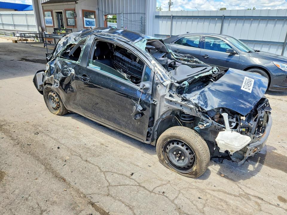 2009 Toyota Yaris VIN JTDJT903295233856 COPART salvage auction — ALL OVER, IN - CERT OF TITLE-SALVAGE TITLE (P), sold $225 on 2026-07-27 (photo 4)