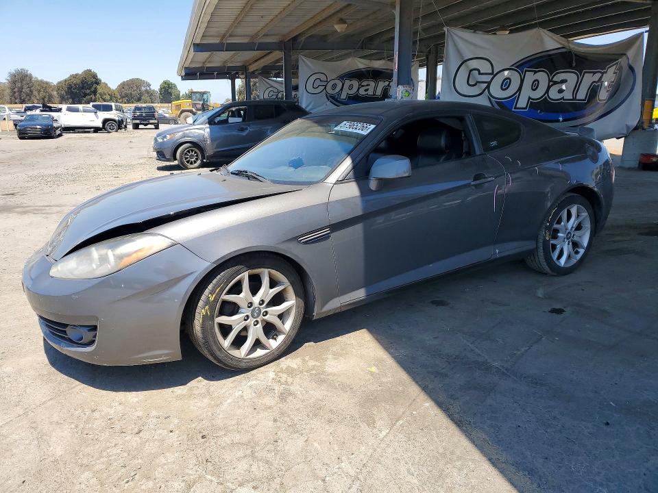 2007 Hyundai Tiburon VIN KMHHN66F77U237425 COPART salvage auction — FRONT END, Ca - Salvage Certificate, sold $150 on 2026-07-30 (photo 1)