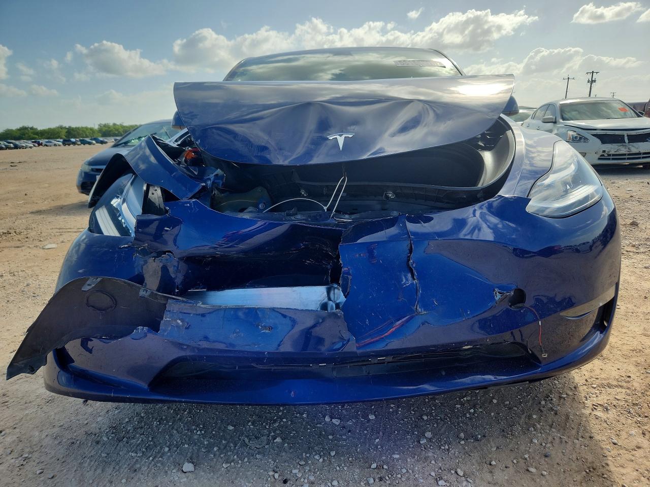 2023 Tesla Model Y VIN 7SAYGDEE6PA107897 COPART salvage auction — Front End, TX - SALVAGE VEHICLE TITLE, sold $9,000 on 2026-07-09 (photo 5)
