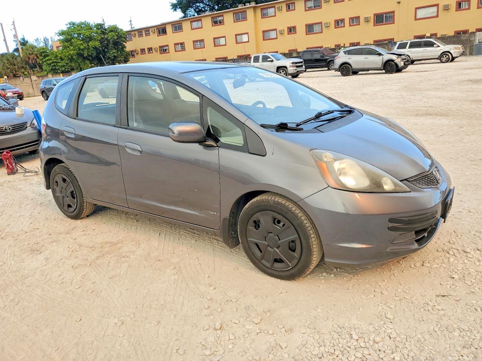 2013 Honda Fit VIN JHMGE8H35DC021104 COPART salvage auction — SIDE, Fl - Cert Of Title Slvg Rebuildable, sold $1,550 on 2026-07-14 (photo 4)