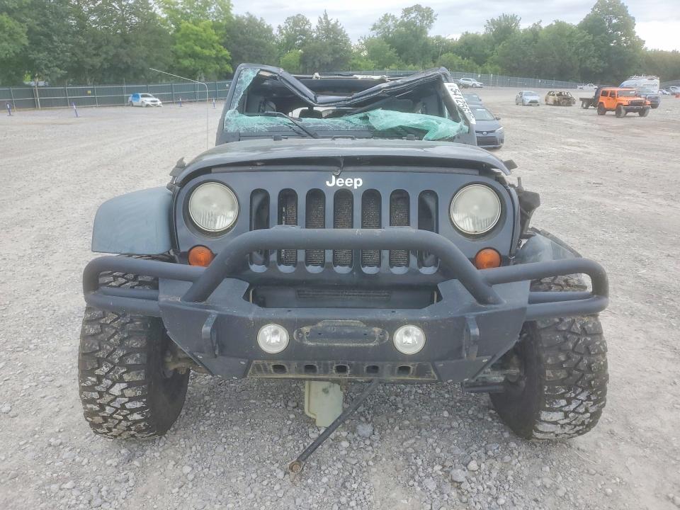 2011 Jeep Wrangler / VIN 1J4BA3H17BL610574 COPART salvage auction — ROLLOVER, Tn - Salvage Certificate, sold $1,000 on 2026-07-09 (photo 5)