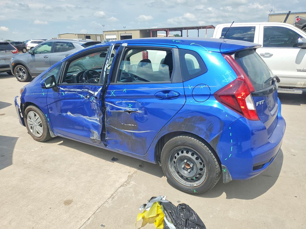2019 Honda Fit VIN 3HGGK5H4XKM700090 COPART salvage auction — Side, TX - SALVAGE VEHICLE TITLE, sold $2,250 on 2026-07-09 (photo 2)