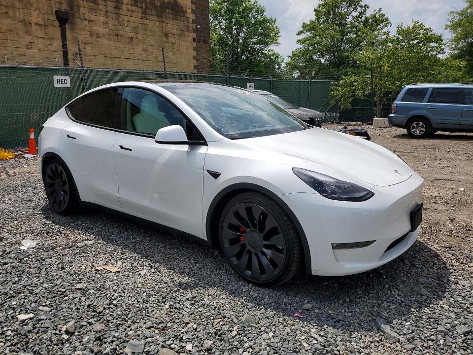 2023 Tesla Model y VIN 7SAYGDEF7PF788423 COPART salvage auction — REAR END, Salvage Title, sold $13,500 on 2026-07-23 (photo 4)