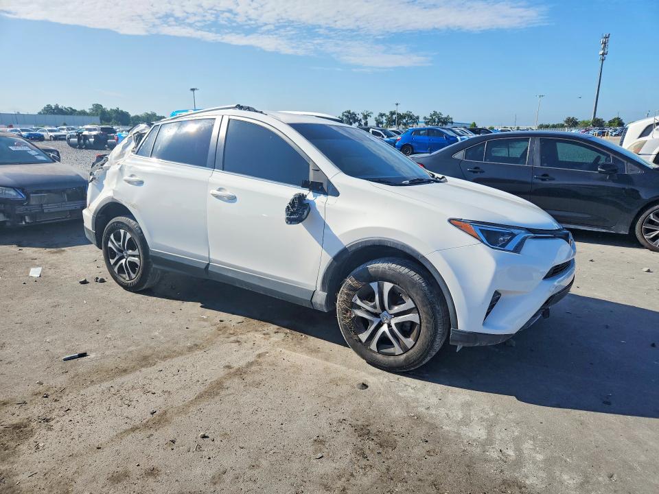 2016 Toyota Rav 4 VIN JTMZFREV6GJ094856 COPART salvage auction — ROLLOVER, Fl - Certificate Of Title, sold $2,450 on 2026-07-27 (photo 4)