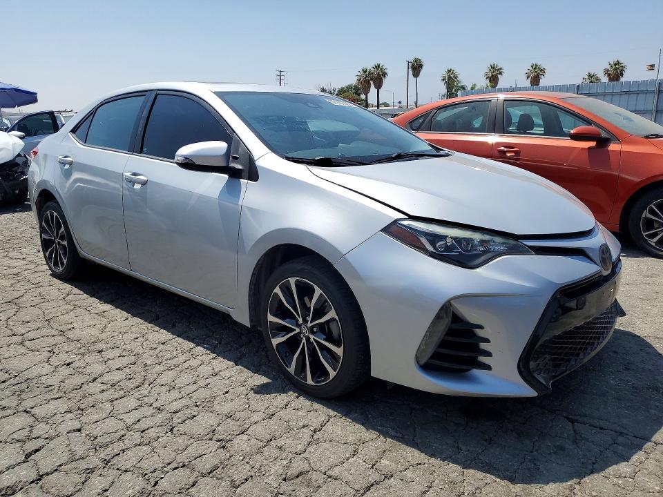2017 Toyota Corolla VIN 5YFBURHE3HP594005 COPART salvage auction — SIDE, Salvage Title, sold $4,550 on 2026-07-16 (photo 4)