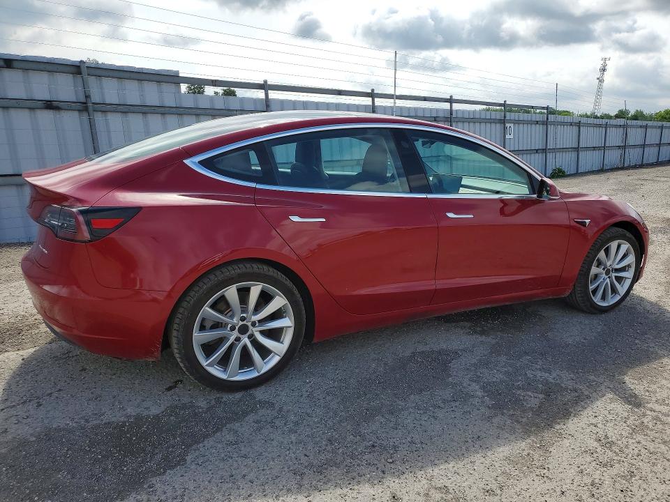 2018 Tesla Model 3 VIN 5YJ3E1EB1JF126997 COPART salvage auction — MINOR DENT/SCRATCHES, On - Permit Rebuilt - Unfit, sold $7,400 on 2026-07-03 (photo 3)