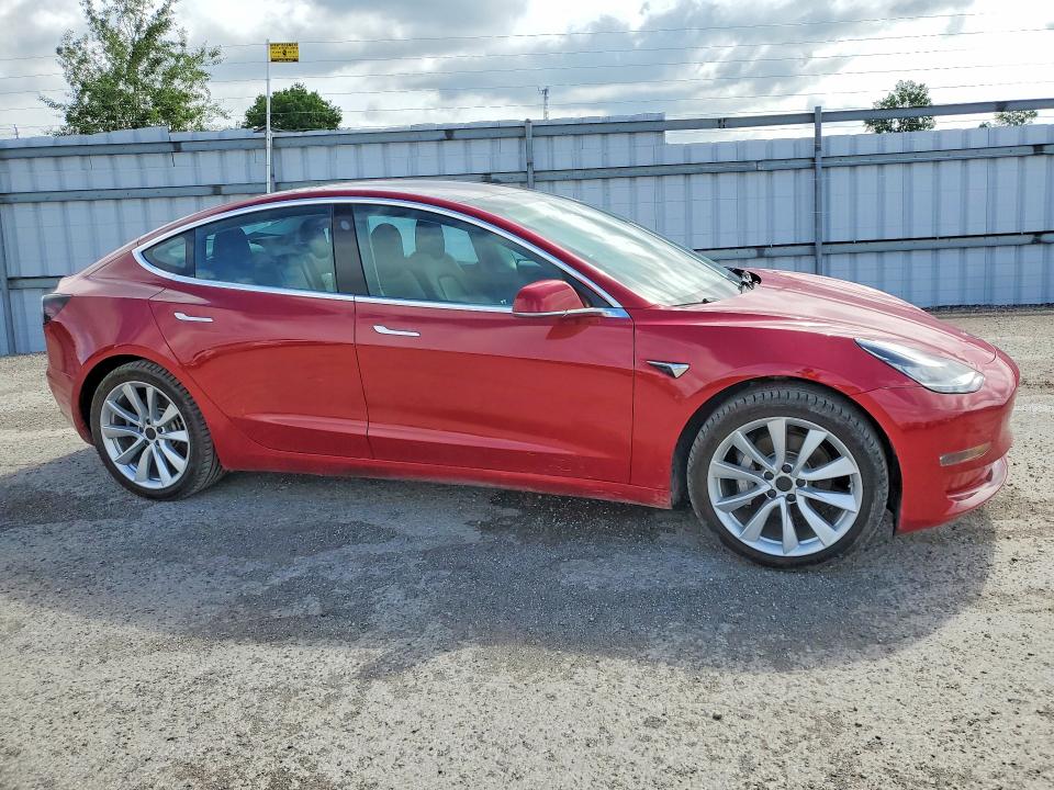 2018 Tesla Model 3 VIN 5YJ3E1EB1JF126997 COPART salvage auction — MINOR DENT/SCRATCHES, On - Permit Rebuilt - Unfit, sold $7,400 on 2026-07-03 (photo 4)