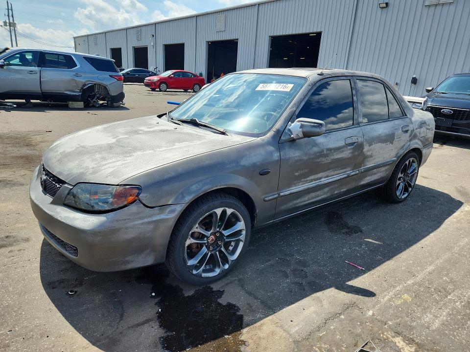 2002 Mazda Protege VIN JM1BJ225X21599996 COPART salvage auction — SIDE, FL - CERT OF TITLE SLVG REBUILDABLE, sold $250 on 2026-07-22 (photo 1)