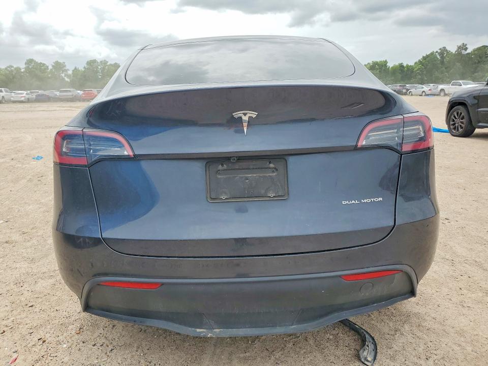 2025 Tesla Model y VIN 7SAYGDEE9SA353397 COPART salvage auction — FRONT END, TX - SALVAGE VEHICLE TITLE (P), sold $14,000 on 2026-07-17 (photo 6)