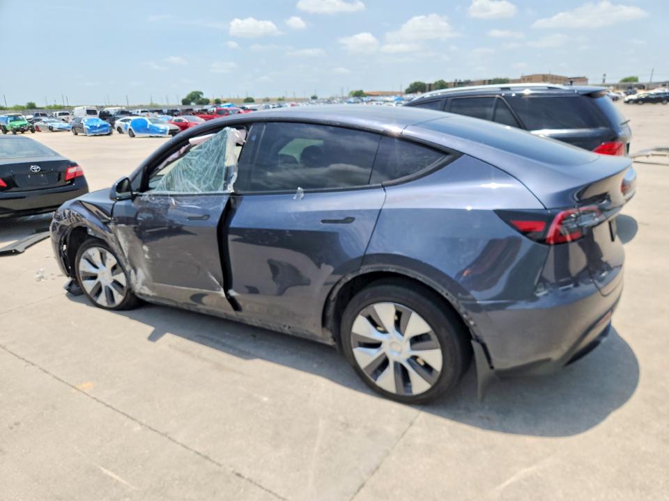 2023 Tesla Model y VIN 7SAYGDEE3PA075300 COPART salvage auction — SIDE, Tx - Salvage Vehicle Title, sold $8,100 on 2026-07-27 (photo 2)