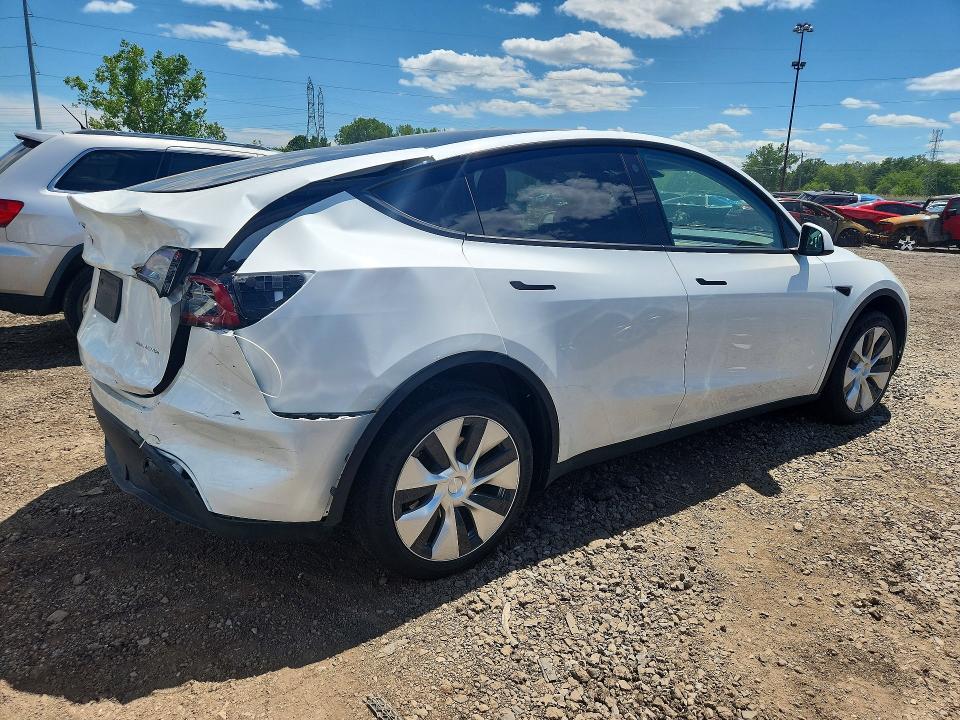 2023 Tesla Model y VIN 7SAYGDEEXPF671829 COPART salvage auction — REAR END, MI - CERTIFICATE OF TITLE, sold $15,600 on 2026-07-10 (photo 3)