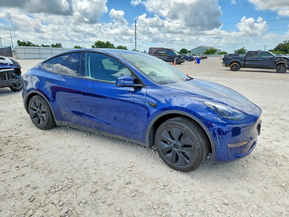 2024 Tesla Model y VIN 7SAYGAEEXRF115490 COPART salvage auction — SIDE, TX - SALVAGE VEHICLE TITLE (P), sold $13,700 on 2026-07-16 (photo 4)