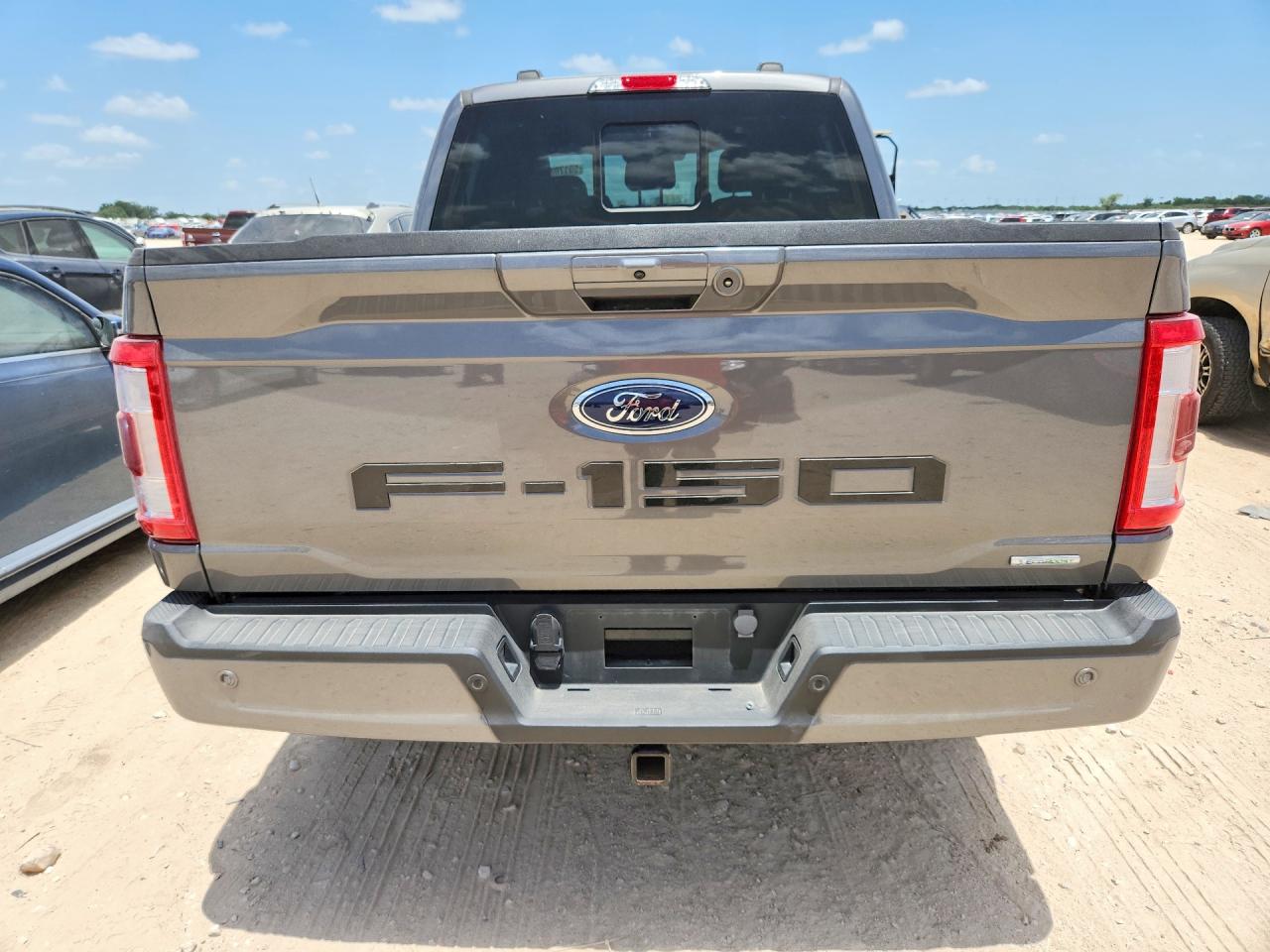 2023 Ford F-150 Lightning VIN 1FTFW1E86PKD71370 COPART salvage auction — Water/Flood, TX - SALVAGE TITLE-FLOOD DAMAGE, sold $26,750 on 2026-08-20 (photo 6)