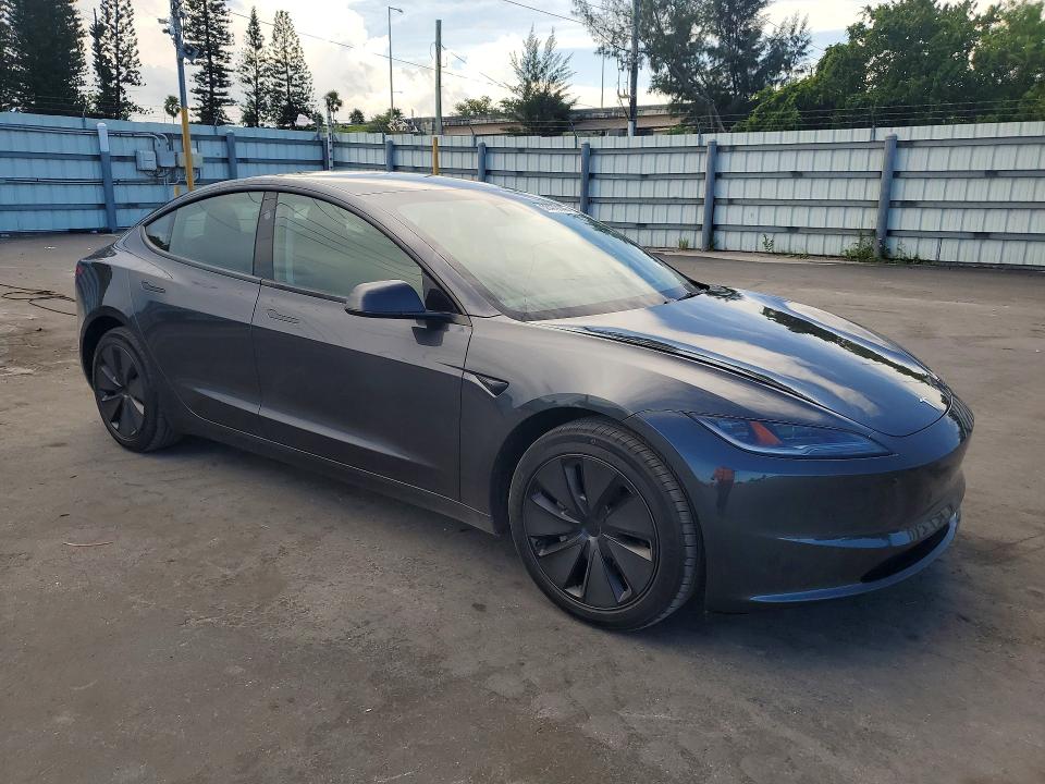 2024 Tesla Model 3 VIN 5YJ3E1EA7RF849613 COPART salvage auction — DAMAGE HISTORY, Fl - Cert Of Title Slvg Rebuildable (P), sold $12,600 on 2026-07-20 (photo 4)