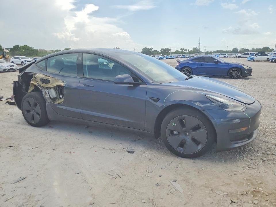 2023 Tesla Model 3 VIN 5YJ3E1EA9PF683950 COPART salvage auction — REAR END, FL - CERT OF TITLE SLVG REBUILDABLE, sold $1,950 on 2026-07-23 (photo 4)