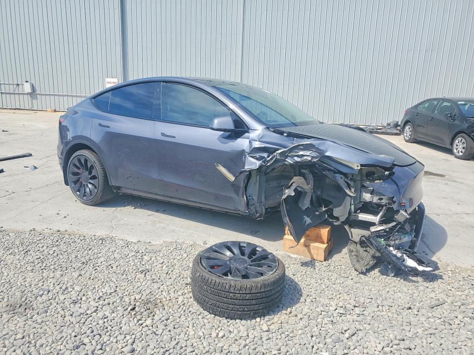 2023 Tesla Model y VIN 7SAYGDEF9PF711908 COPART salvage auction — SIDE, Nv - Salvage Title, sold $10,700 on 2026-07-06 (photo 4)