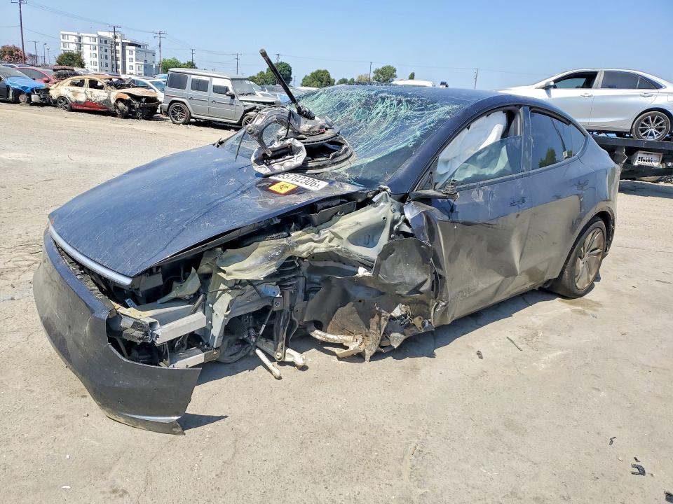 2026 Tesla Model y VIN 7SAYGDEE2TF574957 COPART salvage auction — ALL OVER, CA - SALVAGE CERTIFICATE, sold $12,200 on 2026-07-16 (photo 1)
