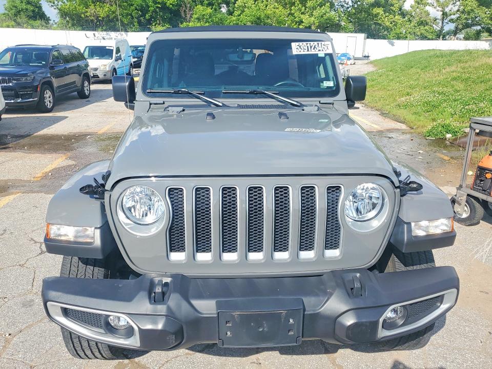 2023 Jeep Wrangler / VIN 1C4HJXEN0PW677098 COPART salvage auction — MINOR DENT/SCRATCHES, Mo - Certificate Of Title, sold $22,500 on 2026-07-02 (photo 5)