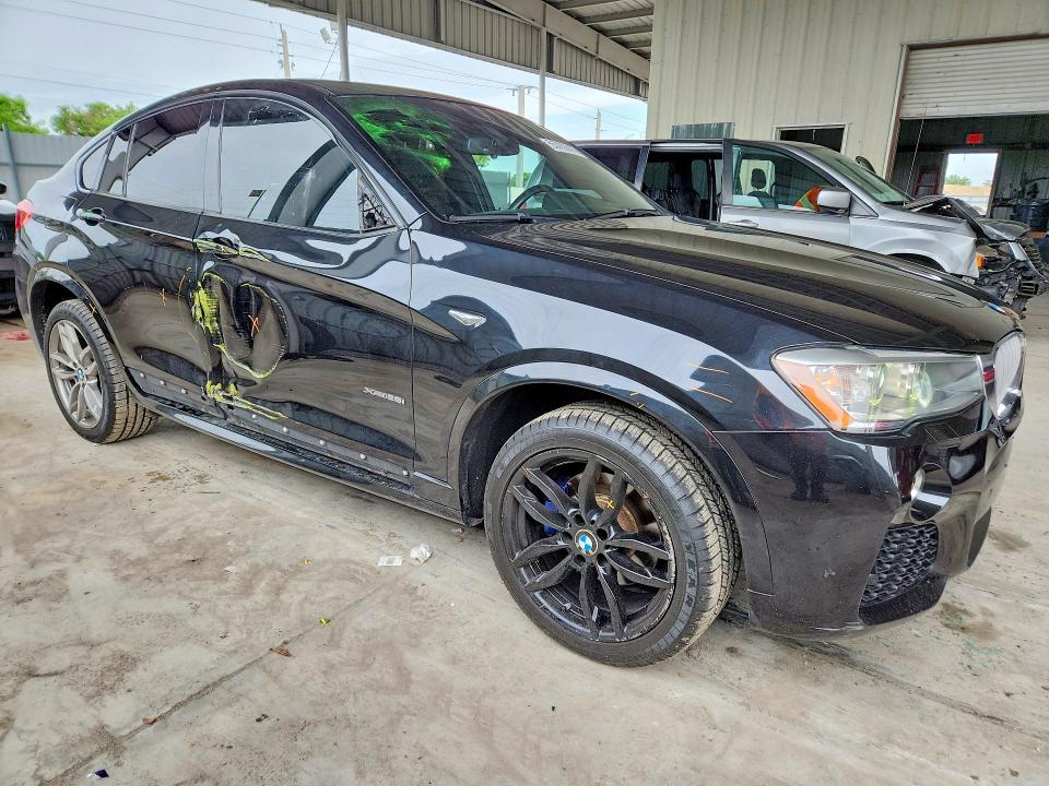 2015 BMW X4 VIN 5UXXW3C58F0M87509 COPART salvage auction — SIDE, Fl - Cert Of Title Slvg Rebuildable, sold $3,950 on 2026-07-27 (photo 4)