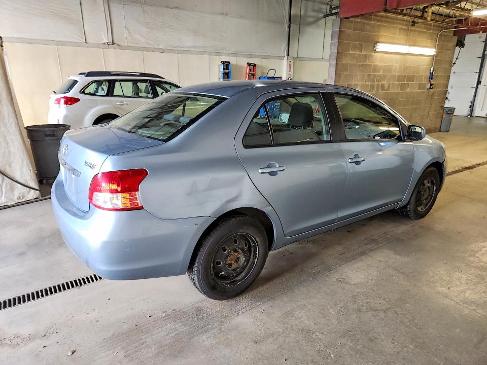 2010 Toyota Yaris VIN JTDBT4K32A4073038 COPART salvage auction — MINOR DENT/SCRATCHES, Ak - Cert Of Veh Title-Reconstructe, sold $1,150 on 2026-07-07 (photo 3)