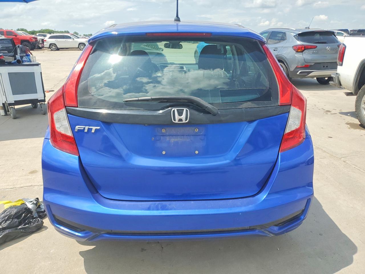 2019 Honda Fit VIN 3HGGK5H4XKM700090 COPART salvage auction — Side, TX - SALVAGE VEHICLE TITLE, sold $2,250 on 2026-07-09 (photo 6)