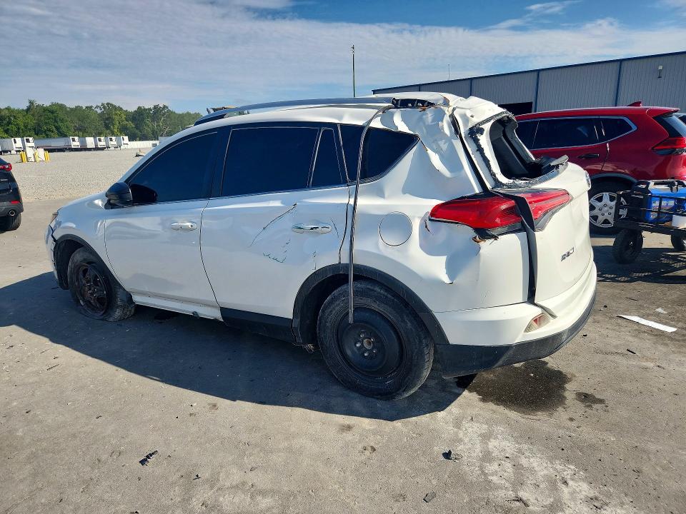 2016 Toyota Rav 4 VIN JTMZFREV6GJ094856 COPART salvage auction — ROLLOVER, Fl - Certificate Of Title, sold $2,450 on 2026-07-27 (photo 2)