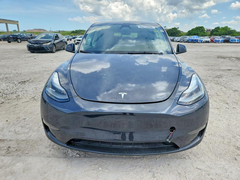 2024 Tesla Model y VIN 7SAYGDEDXRF050990 COPART salvage auction — REAR END, Fl - Cert Of Title Slvg Rebuildable, sold $8,600 on 2026-07-09 (photo 5)