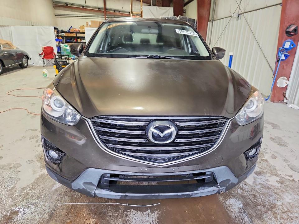 2016 Mazda Cx-5 VIN JM3KE2CY0G0908490 COPART salvage auction — MINOR DENT/SCRATCHES, Nm - Certificate Of Title (P), sold $1,500 on 2026-07-15 (photo 5)